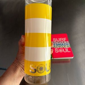 Soul Cycle 32 ounce water bottle and Soul Cycle four pack of mini journals.